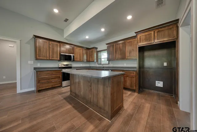 a view of kitchen with microwave and stove