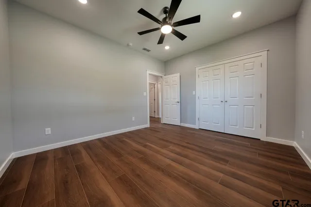 a view of room with wooden floor