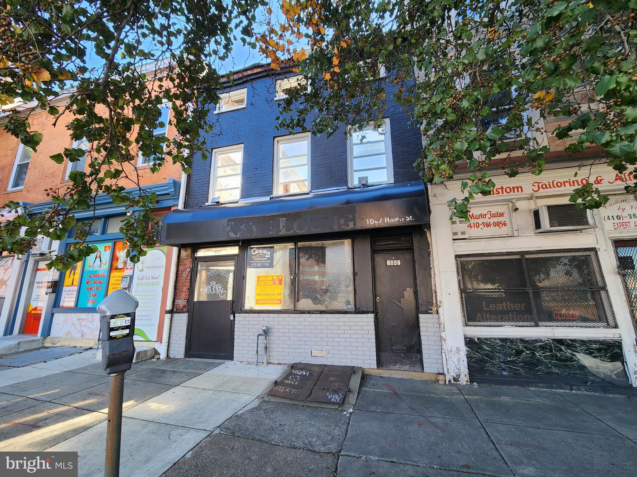 1047 Hillen Street Baltimore, MD 21202 - Photo 2 of 7 a front view of a building with garage