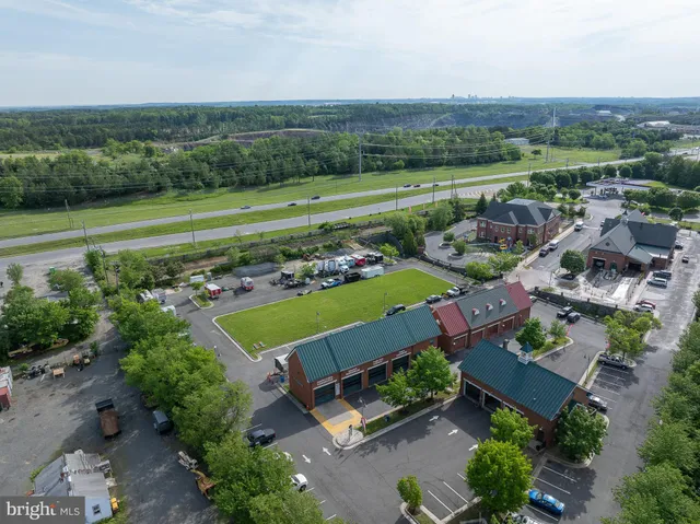 an aerial view of a houses with outdoor space and garden