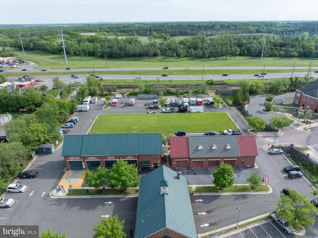 an aerial view of a houses with outdoor space and city view
