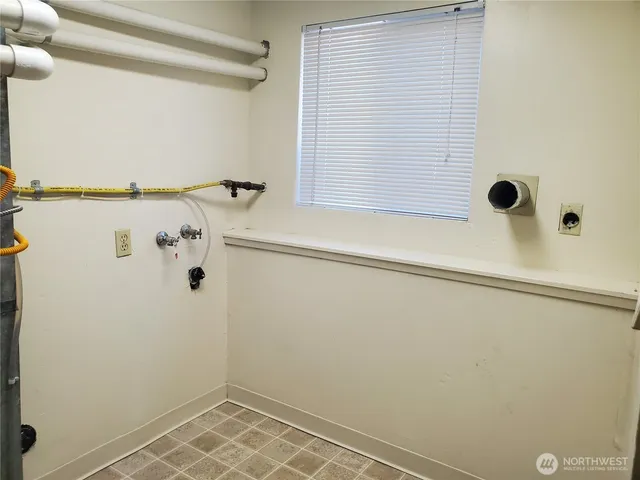 a view of a room with wooden walls