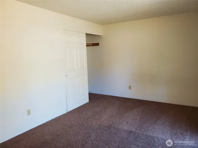 an empty room with a bench