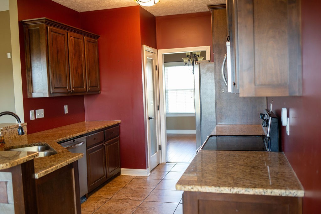 1150 Payne Road Portland, TN 37148 - Photo 10 of 59 a kitchen with a sink and a stove top oven