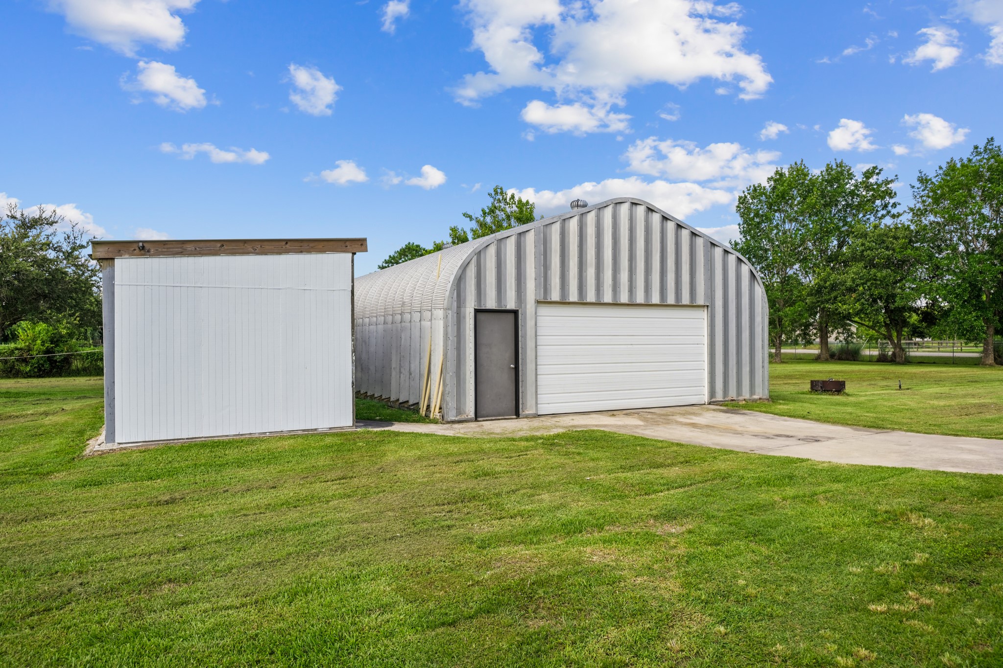 4435 South Tower Road Santa Fe, TX 77517 - Photo 31 of 35 The impressive insulated 30' x 40' Quonset workshop provides approximately 1,200 square feet of workspace plus extensive upstairs storage, making it ideal for hobbies, equipment, or a home business.