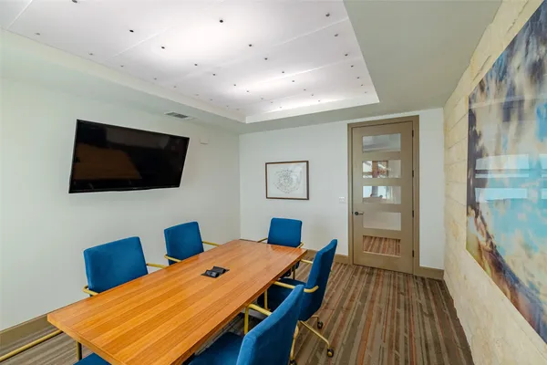 a room with furniture and a flat screen tv