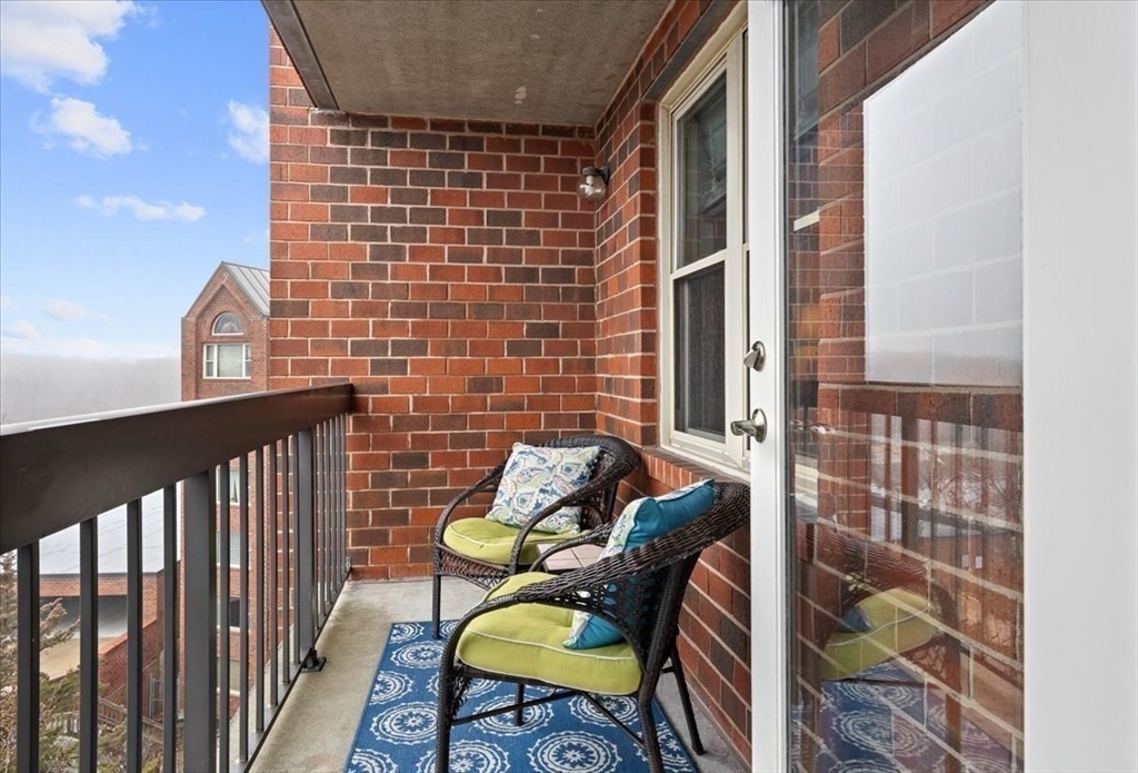 155 George Washington Boulevard, Unit 707 Hull, MA 02045 - Photo 17 of 24 a view of balcony with a potted plant and outdoor seating