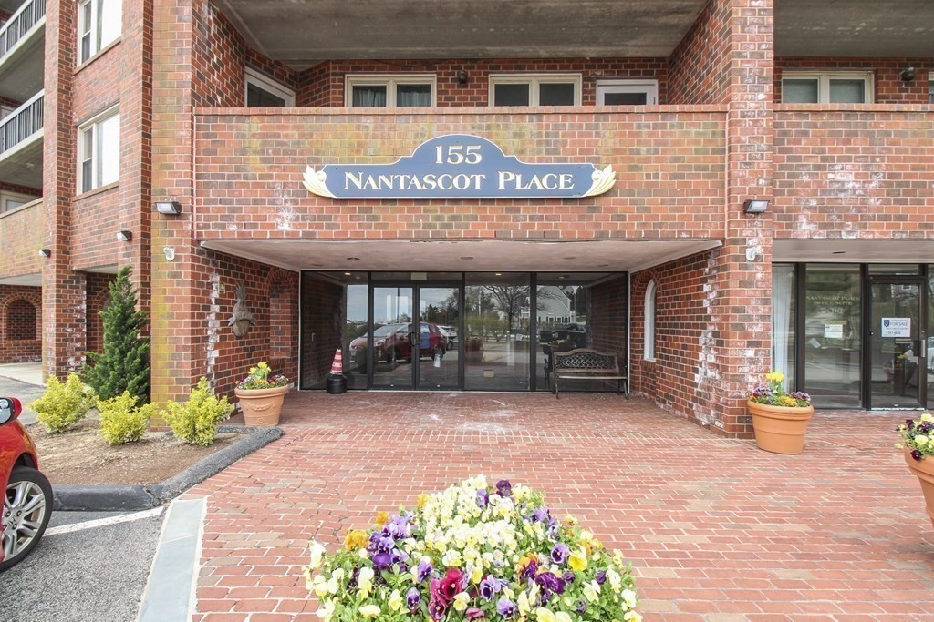 155 George Washington Boulevard, Unit 707 Hull, MA 02045 - Photo 2 of 24 a front view of a building with an outdoor space