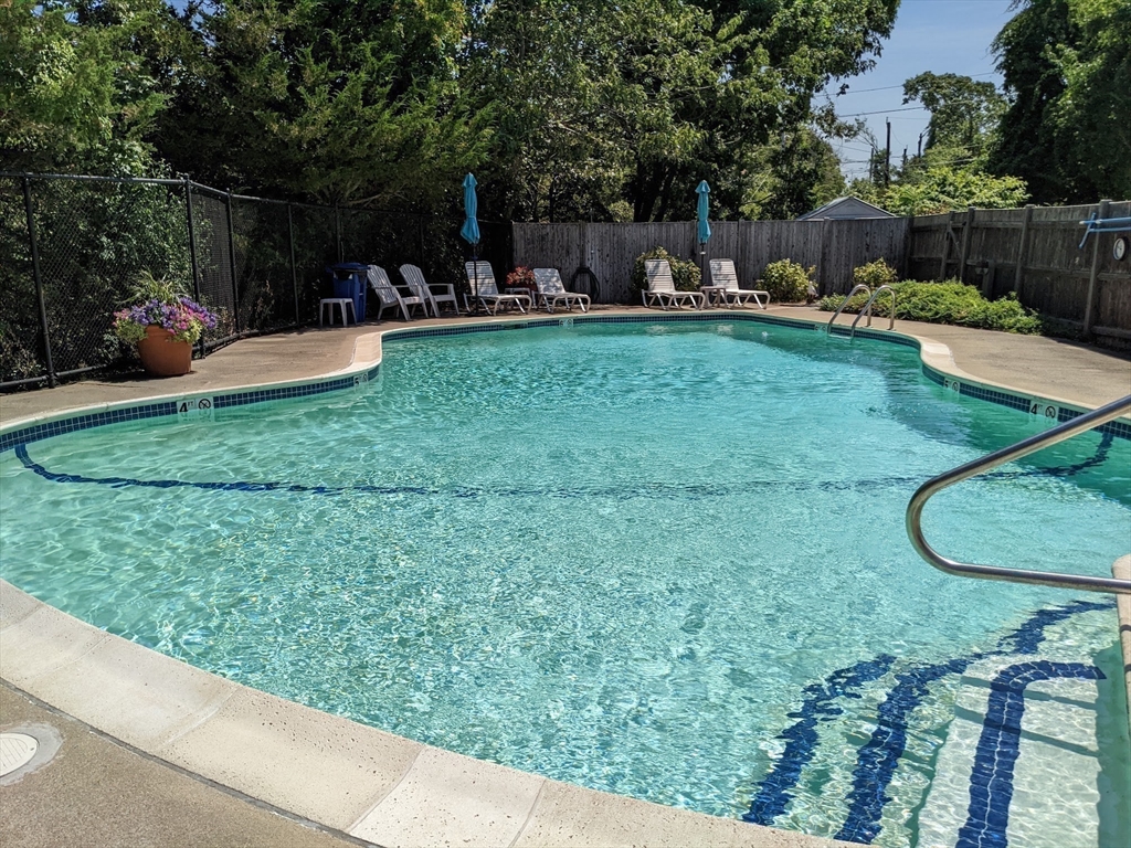 155 George Washington Boulevard, Unit 707 Hull, MA 02045 - Photo 22 of 24 a view of a backyard with sitting area and furniture