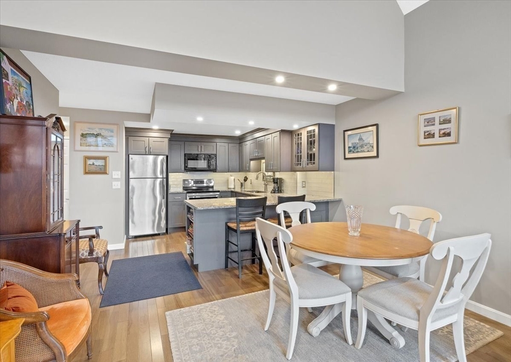 155 George Washington Boulevard, Unit 707 Hull, MA 02045 - Photo 10 of 24 a view of a dining room with furniture
