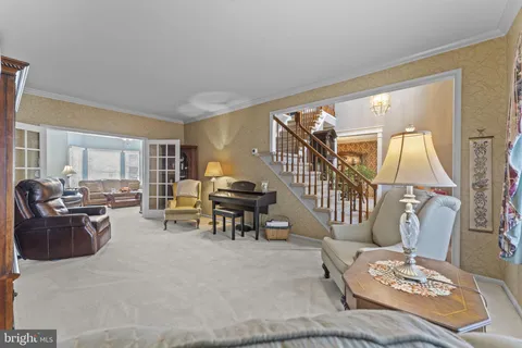 a living room with furniture and a table