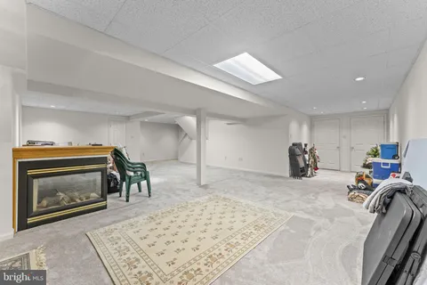 a view of a livingroom with furniture and a fireplace