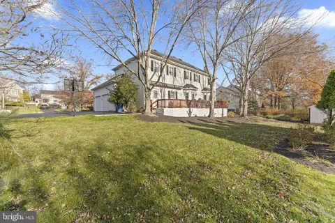 a view of a big yard with large trees