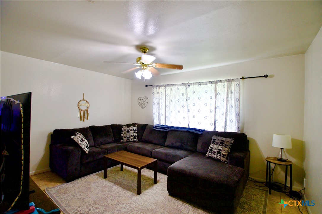 1411 West Lane Killeen, TX 76549 - Photo 11 of 36 a living room with furniture and a window