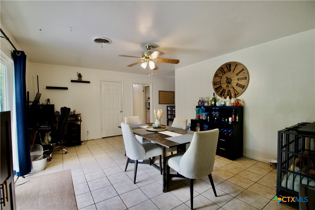 1411 West Lane Killeen, TX 76549 - Photo 13 of 36 a view of a dining room with furniture and a chandelier