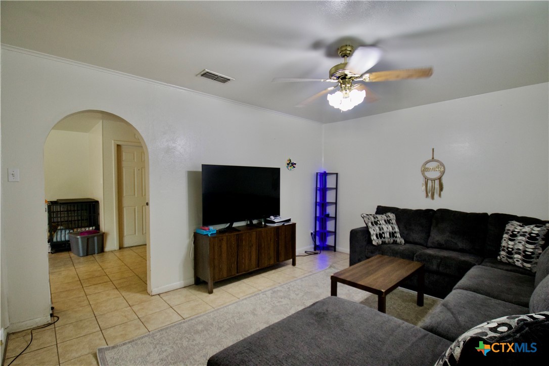 1411 West Lane Killeen, TX 76549 - Photo 22 of 36 a living room with furniture and a flat screen tv