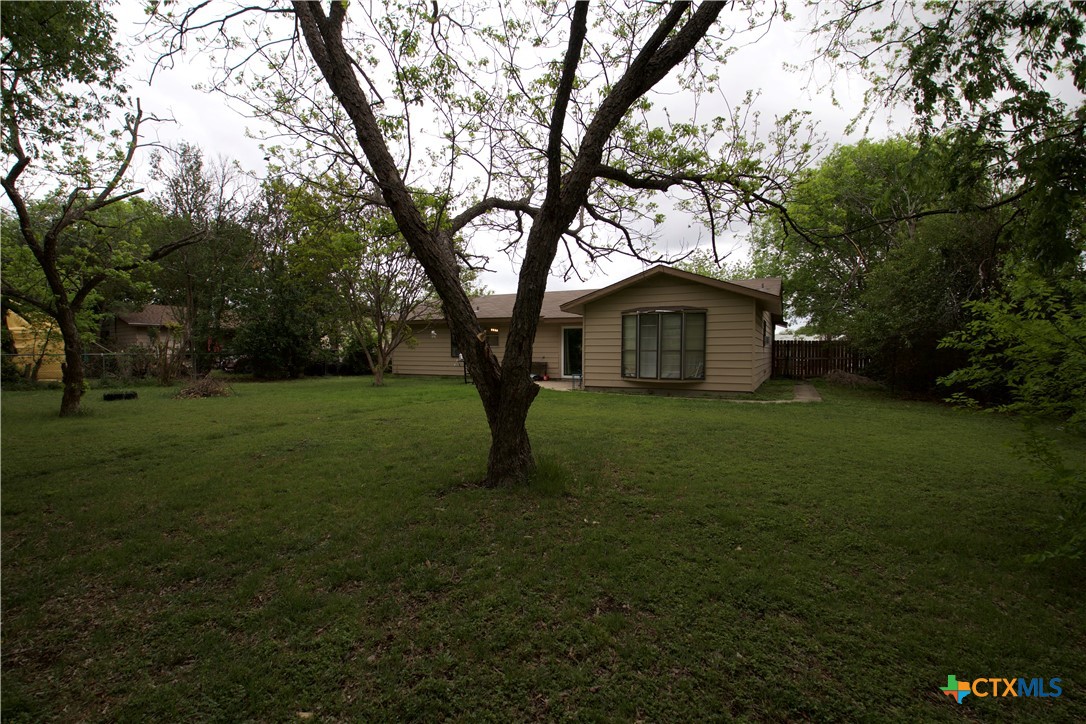 1411 West Lane Killeen, TX 76549 - Photo 27 of 36 a yellow house in middle of forest
