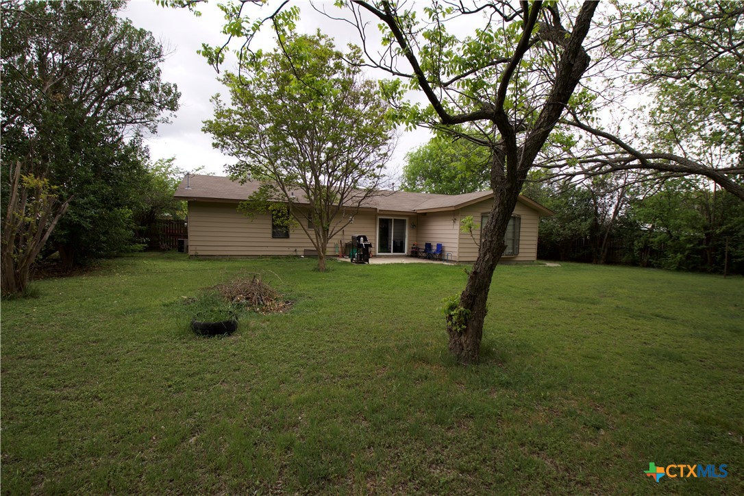 1411 West Lane Killeen, TX 76549 - Photo 30 of 36 a view of a house with backyard and a tree