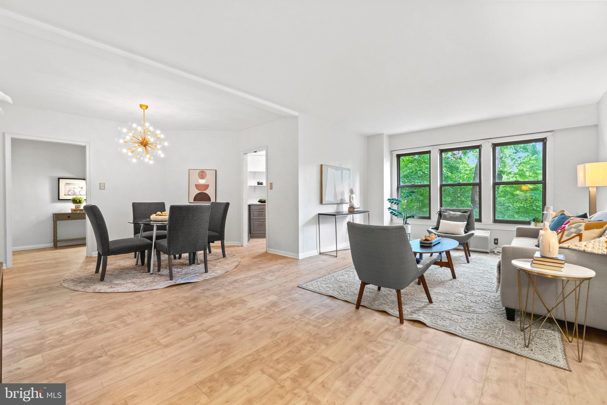 2500 Q Street Northwest, Unit 206 Washington, DC 20007 - Photo 1 of 21 a living room with furniture and a large window