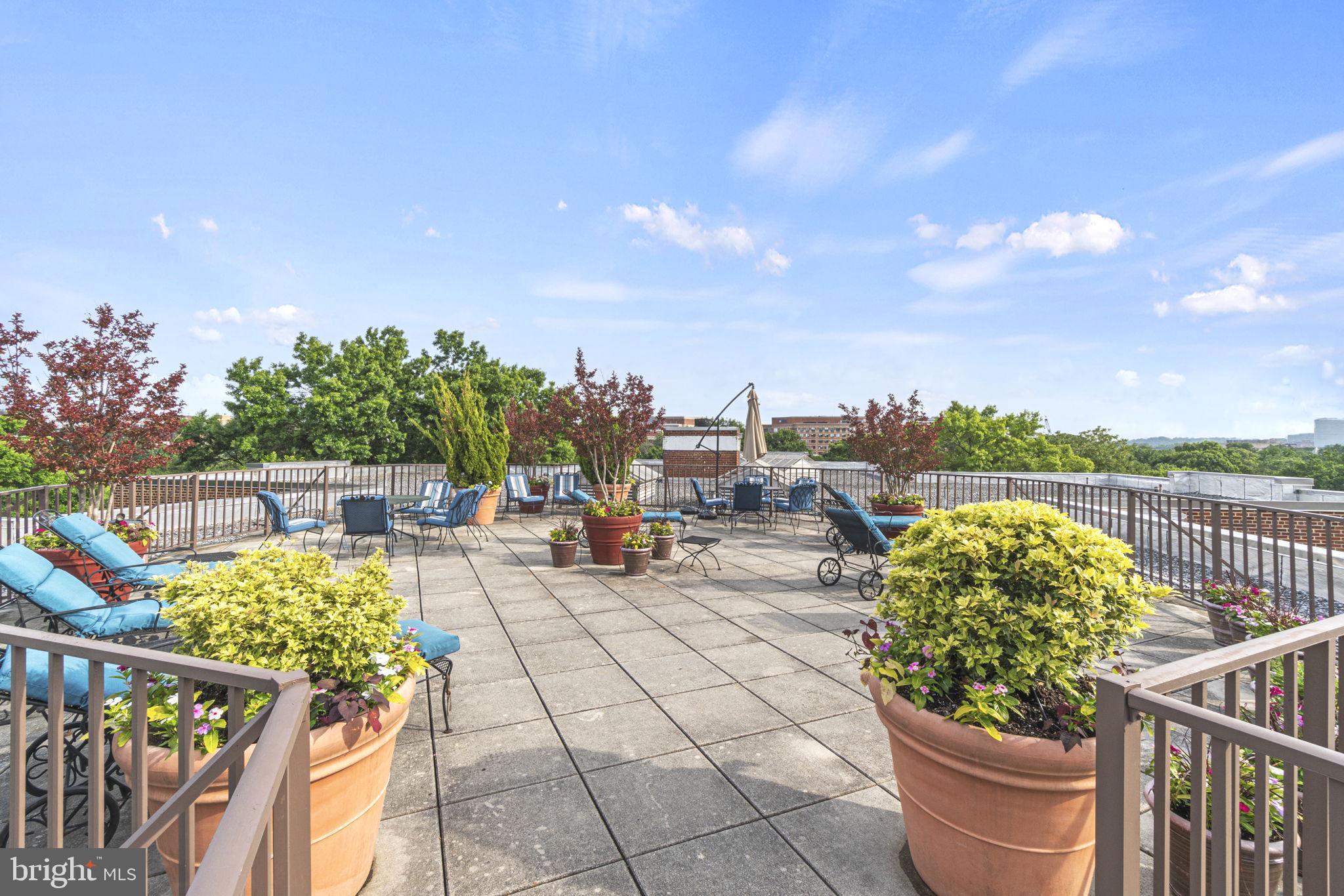 2500 Q Street Northwest, Unit 206 Washington, DC 20007 - Photo 14 of 21 a view of a terrace with furniture and city view