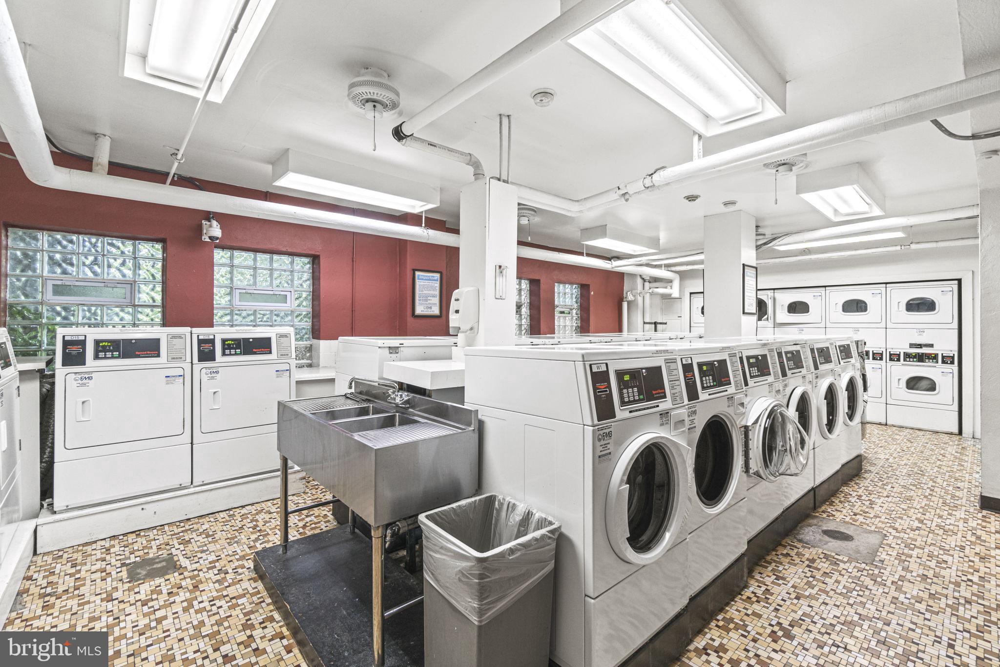 2500 Q Street Northwest, Unit 206 Washington, DC 20007 - Photo 16 of 21 a kitchen with stainless steel appliances granite countertop a sink and cabinets