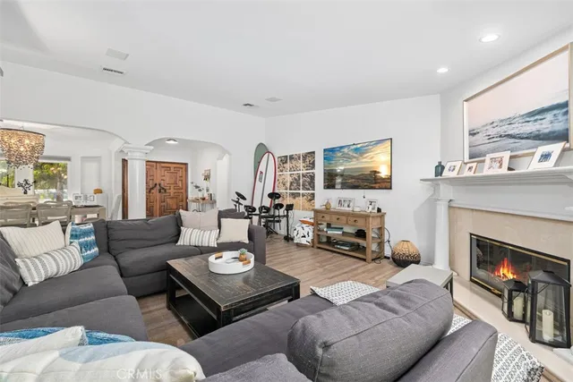 a living room with furniture fireplace and a flat screen tv