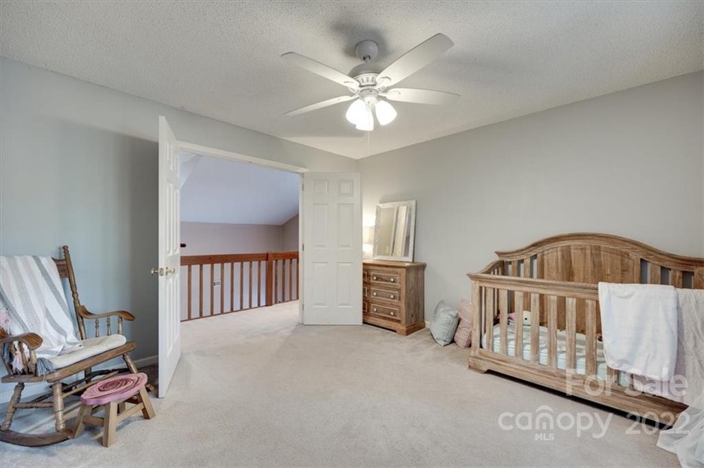 100 Banksridge Road Fort Mill, SC 29715 - Photo 15 of 27 a bedroom with furniture and baby crib