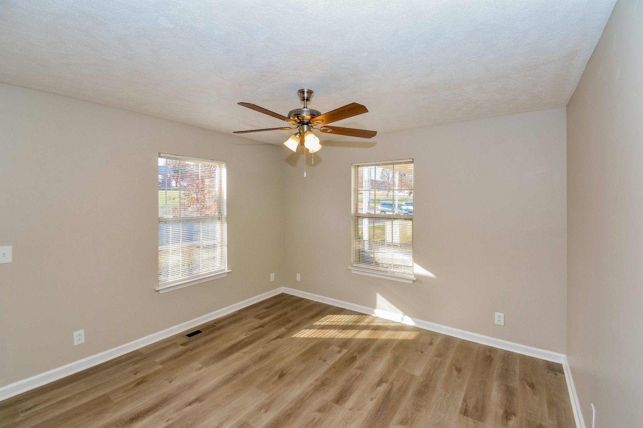 2607 Landrum Court, Unit LOT 7 Springfield, TN 37172 - Photo 12 of 16 an empty room with wooden floor and windows