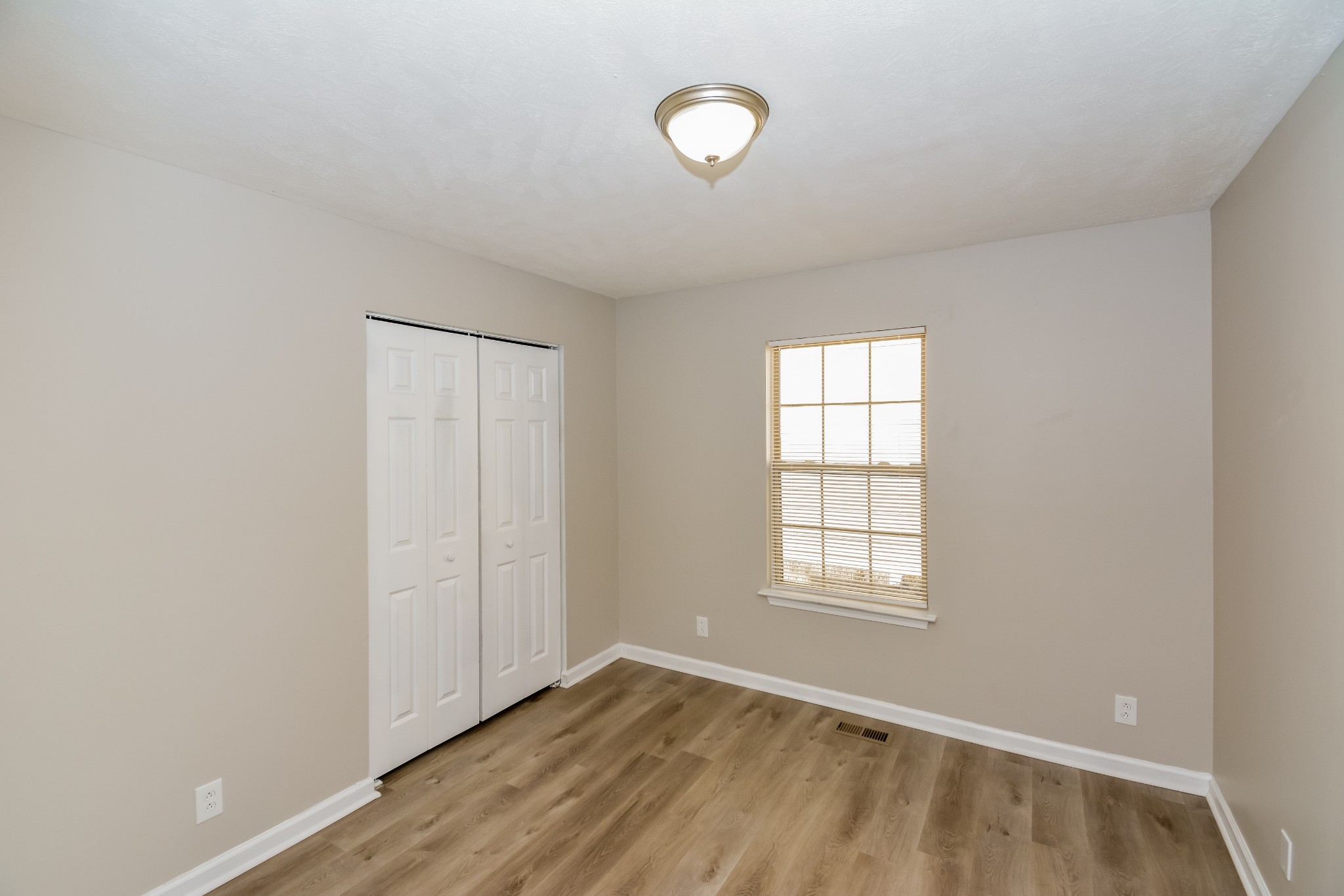 2607 Landrum Court, Unit LOT 7 Springfield, TN 37172 - Photo 13 of 16 an empty room with windows and closet