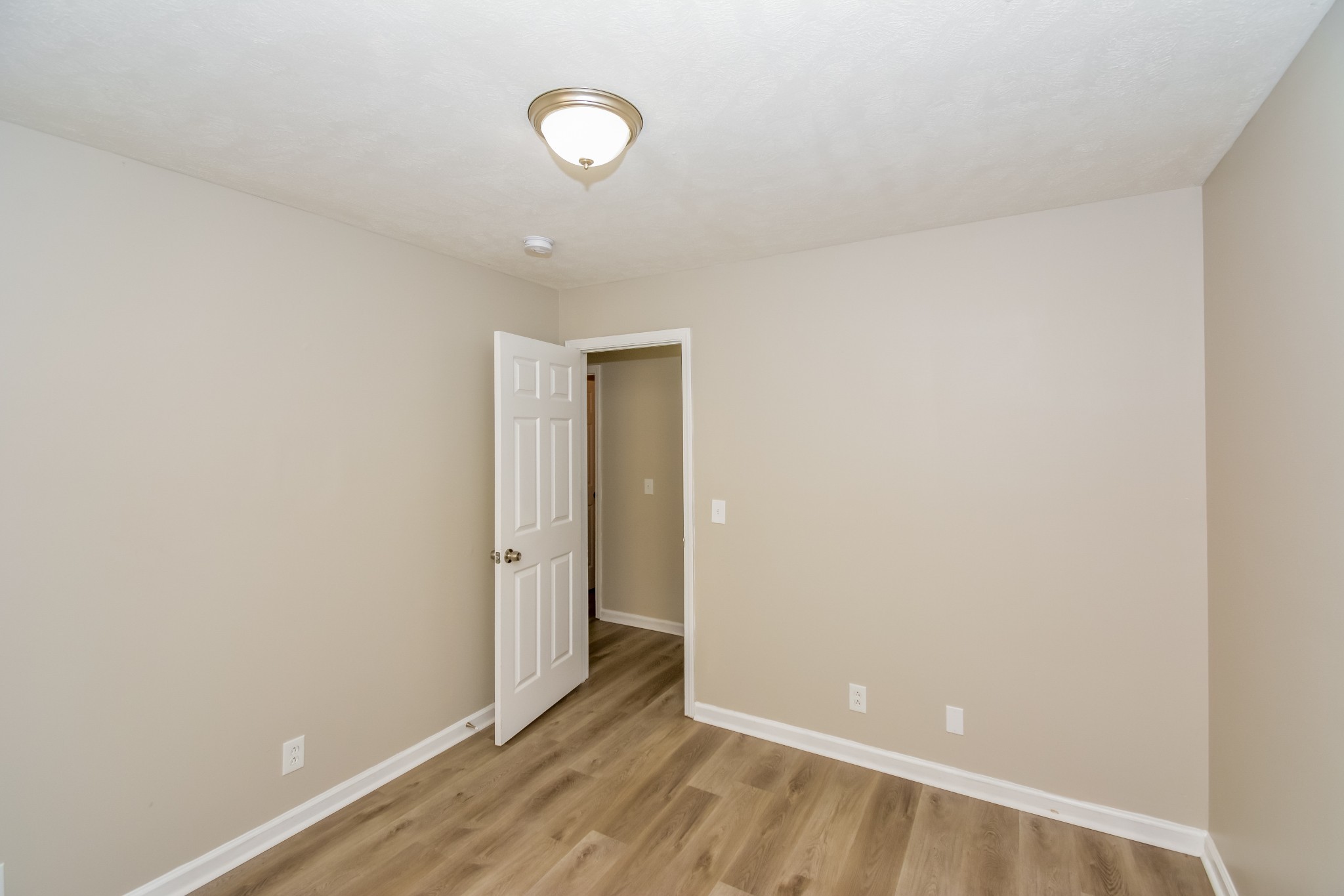 2607 Landrum Court, Unit LOT 7 Springfield, TN 37172 - Photo 14 of 16 a view of an empty room with wooden floor