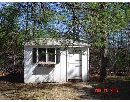 155 Windswept Road Wareham, MA 02571 - Photo 2 of 9 a view of a house with a yard