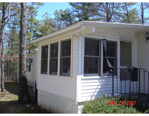 155 Windswept Road Wareham, MA 02571 - Photo 4 of 9 a front view of a house with a garden