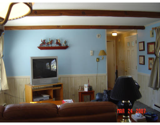 155 Windswept Road Wareham, MA 02571 - Photo 6 of 9 a living room with furniture and a fireplace