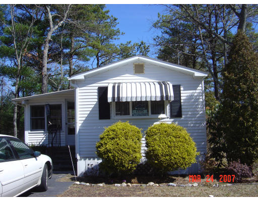 155 Windswept Road Wareham, MA 02571 - Photo 7 of 9 a front view of a house with garden