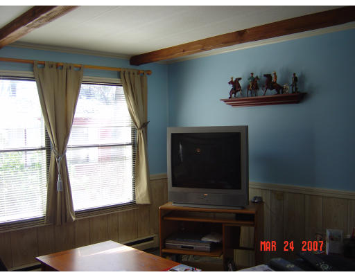 155 Windswept Road Wareham, MA 02571 - Photo 8 of 9 a living room with furniture and a flat screen tv