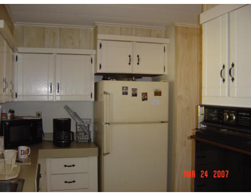 155 Windswept Road Wareham, MA 02571 - Photo 9 of 9 a kitchen with a refrigerator and cabinets
