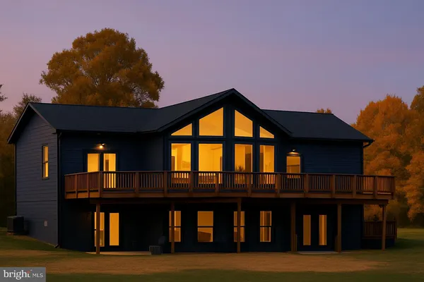 a front view of house with yard and mountain view
