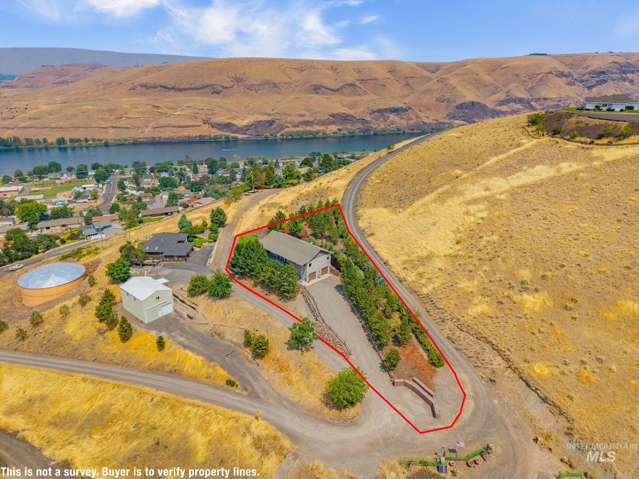 602 Quarry Road Asotin, WA 99402 - Photo 5 of 49 Property parcel featuring a main structure, a secondary structure, and a gravel driveway