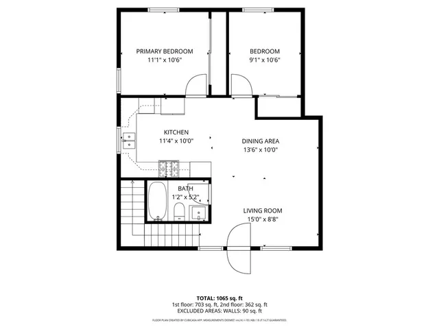 a picture of a bench in front of a wall