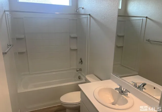 a bathroom with a sink a toilet and a bathtub