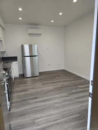 a view of kitchen and wooden floor