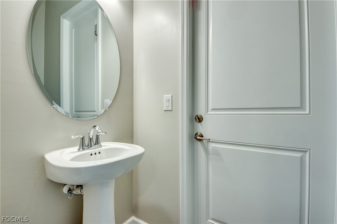 11674 Russet Trail Fort Myers, FL 33913 - Photo 16 of 47 a bathroom with a sink and a mirror