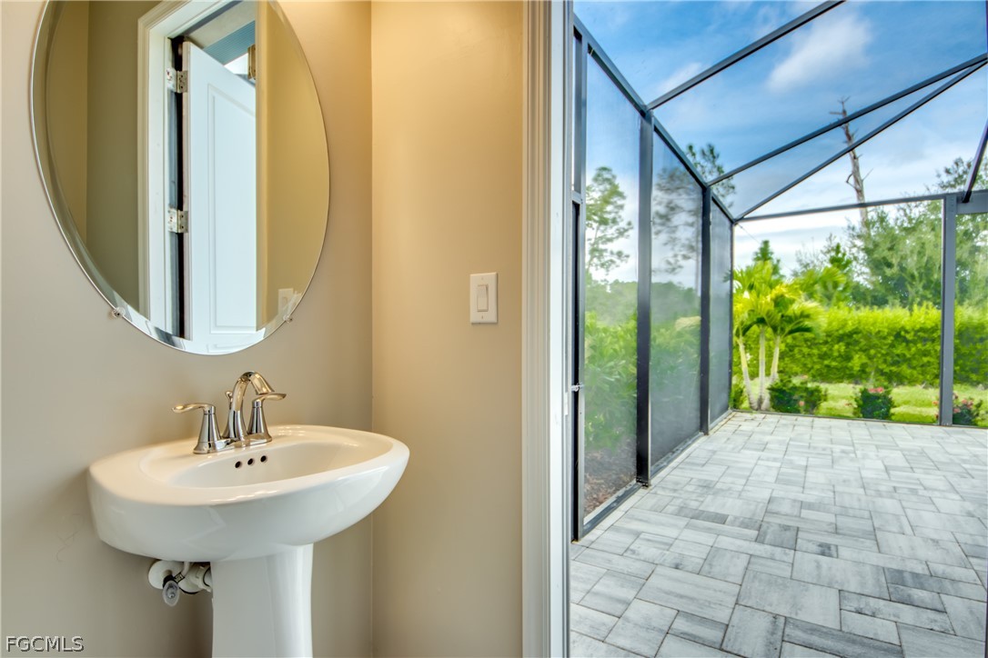 11674 Russet Trail Fort Myers, FL 33913 - Photo 17 of 47 a bathroom with a sink and a mirror