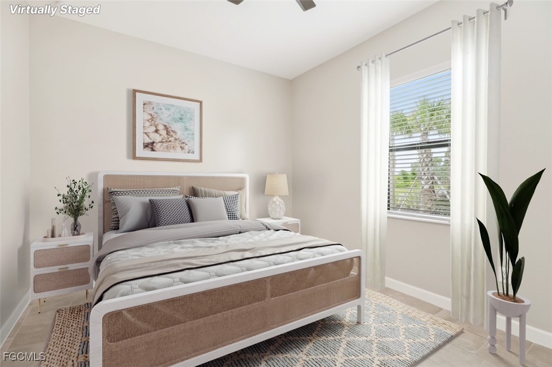 11674 Russet Trail Fort Myers, FL 33913 - Photo 18 of 47 a bedroom with a bed and a flat screen tv