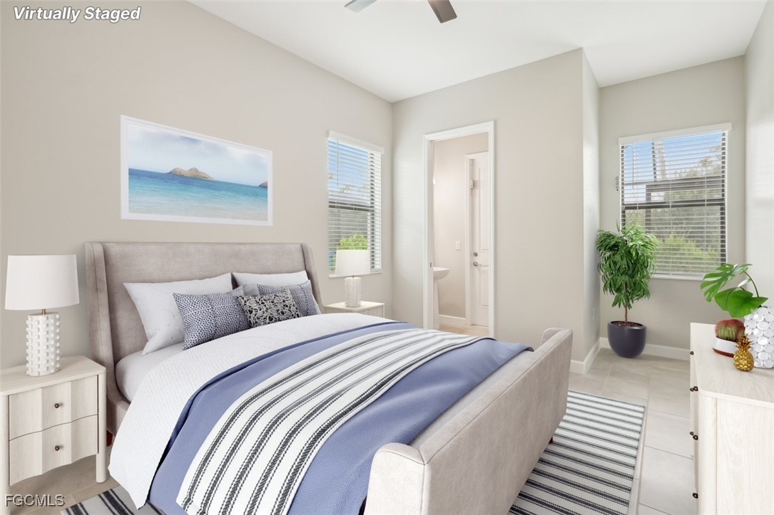 11674 Russet Trail Fort Myers, FL 33913 - Photo 19 of 47 a bedroom with bed and a potted plant