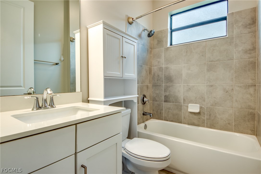 11674 Russet Trail Fort Myers, FL 33913 - Photo 20 of 47 a bathroom with a sink a toilet and shower