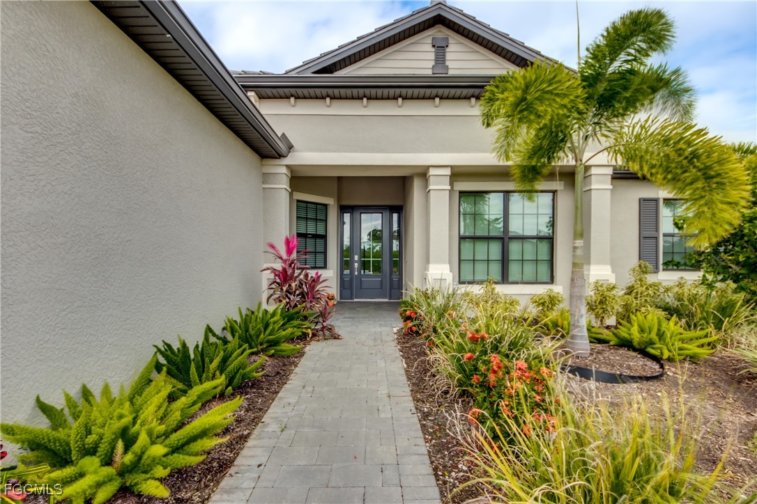 11674 Russet Trail Fort Myers, FL 33913 - Photo 2 of 47 a view of a house with potted plants