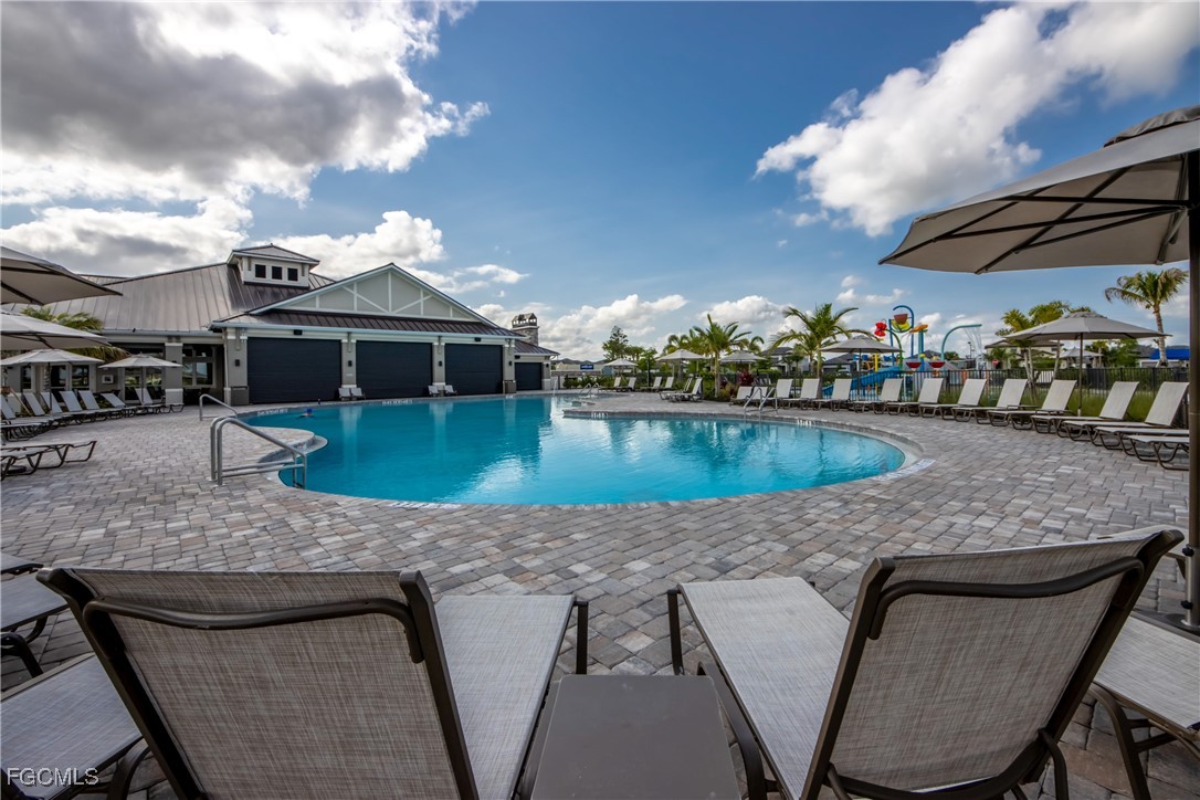 11674 Russet Trail Fort Myers, FL 33913 - Photo 35 of 47 a view of a house with swimming pool and sitting area