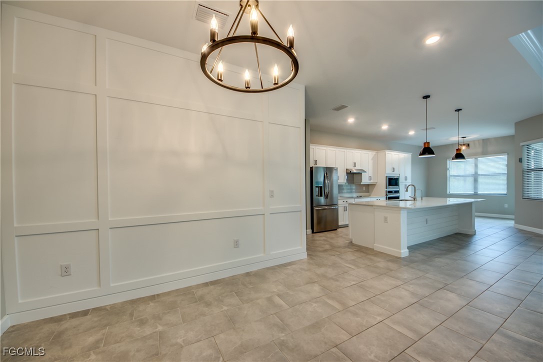 11674 Russet Trail Fort Myers, FL 33913 - Photo 4 of 47 a view of kitchen and windows