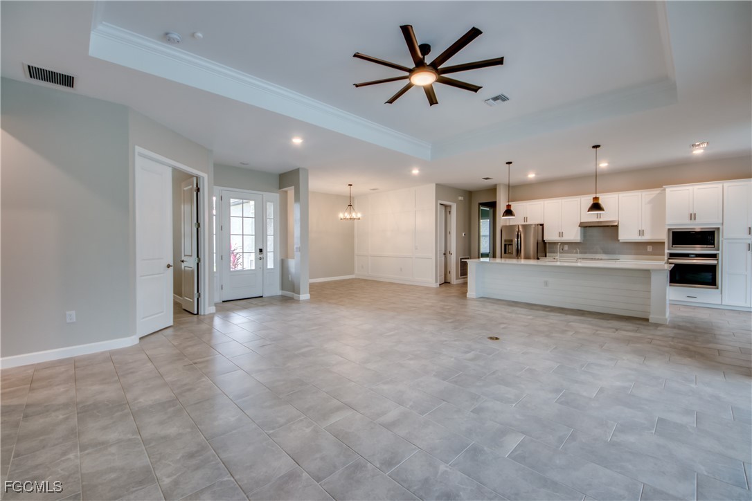 11674 Russet Trail Fort Myers, FL 33913 - Photo 5 of 47 a view of a big room with kitchen view and a window